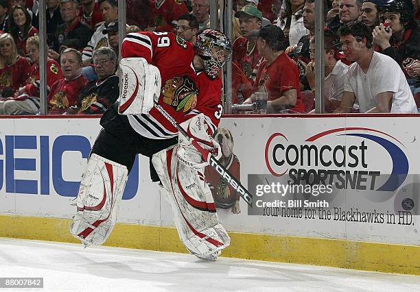 Nikolai Khabibulin of the Chicago Blackhawks passes the puck to his teammates during Game Three of the Western Conference Finals of the 2009 Stanley...