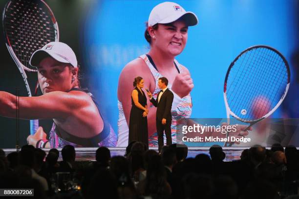 John Newcombe medallist Ashleigh Barty with host Rove McManus at the 2017 Newcombe Medal at Crown Palladium on November 27, 2017 in Melbourne,...