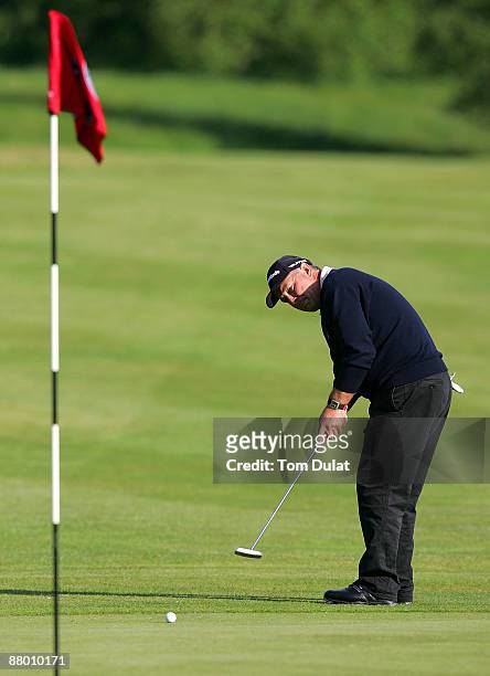 Donald Stirling of Wien - Sussenbrunn makes a putt on the 18th green during the Senior PGA Professional Championship at The Northants County Golf...