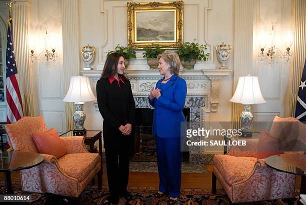 Secretary of State Hillary Clinton speaks with Roxana Saberi, an American journalist that was freed last week from an Iranian prison, during a...