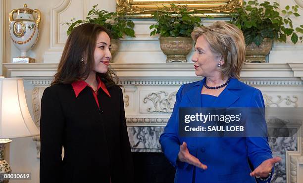 Secretary of State Hillary Clinton speaks with Roxana Saberi, an American journalist that was freed last week from an Iranian prison, during a...