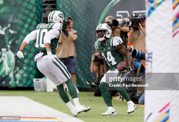 Jeremy Kerley celebrates with teammate Jermaine Kearse of the New York Jets after catching a pass for a touchdown in an NFL football game against the...