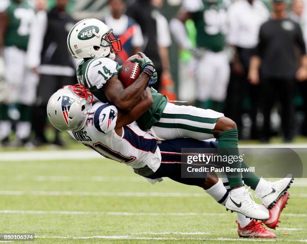 Jonathan Jones of the New England Patriots tackles Jeremy Kerley of the New York Jets after a Kerley caught a punt during an NFL football game on...