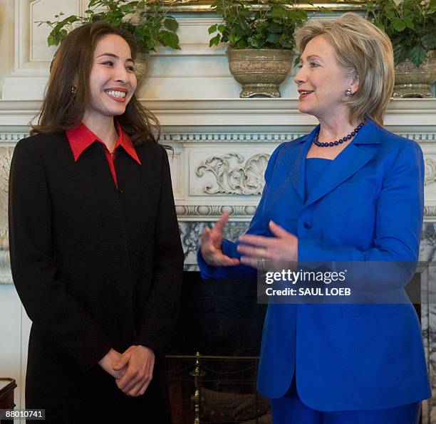 Secretary of State Hillary Clinton speaks with Roxana Saberi, an American journalist that was freed last week from an Iranian prison, during a...