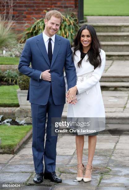 Prince Harry and actress Meghan Markle during an official photocall to announce their engagement at The Sunken Gardens at Kensington Palace on...