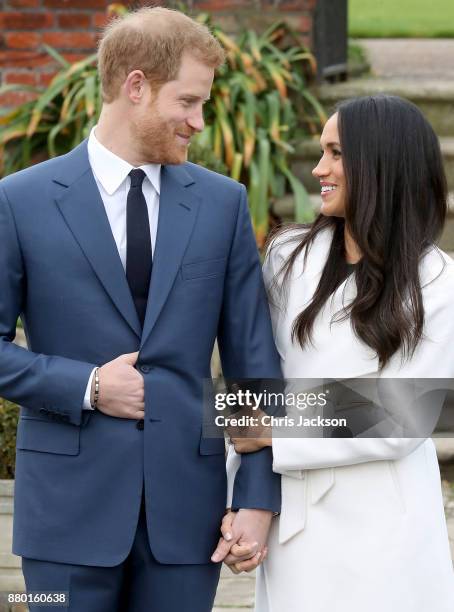 Prince Harry and actress Meghan Markle during an official photocall to announce their engagement at The Sunken Gardens at Kensington Palace on...