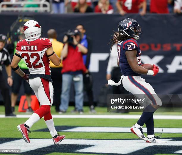 Onta Foreman of the Houston Texans rushes for a touchdown past Tyrann Mathieu of the Arizona Cardinals at NRG Stadium on November 19, 2017 in...