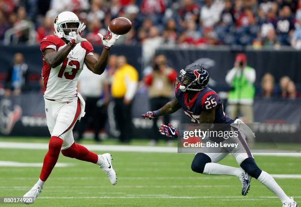 Jaron Brown of the Arizona Cardinals catches a pass in front of Kareem Jackson of the Houston Texans at NRG Stadium on November 19, 2017 in Houston,...