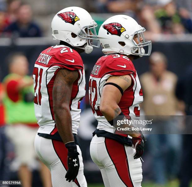 Patrick Peterson of the Arizona Cardinals and Tyrann Mathieu during a break in play against the Houston Texans at NRG Stadium on November 19, 2017 in...