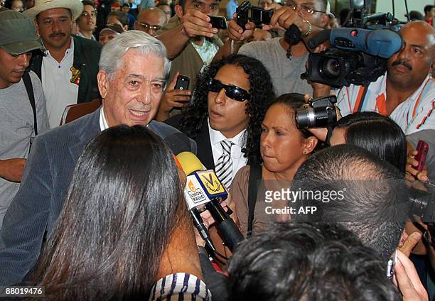 Peruvian writer Mario Vargas Llosa speaks with the press upon arrival at the Simon Bolivar airport in Caracas on May 27, 2009. Venezuelan authorities...