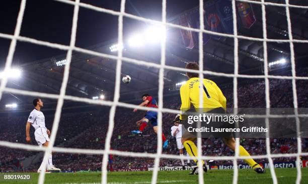 Lionel Messi of Barcelona scores past Manchester United goalkeeper Edwin van der Sar during the UEFA Champions League Final match between Barcelona...