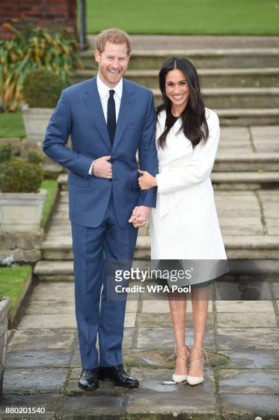 Prince Harry and actress Meghan Markle during an official photocall to announce their engagement at The Sunken Gardens at Kensington Palace on...
