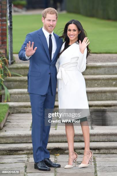 Prince Harry and actress Meghan Markle during an official photocall to announce their engagement at The Sunken Gardens at Kensington Palace on...