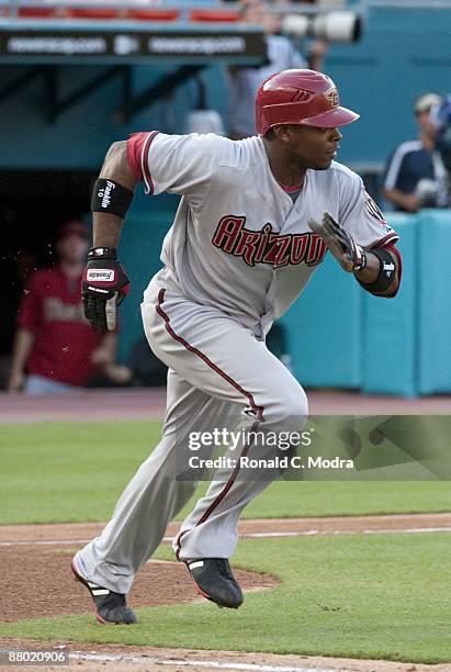 Justin Upton of the Arizona Diamondbacks runs to first base during a game against the Florida Marlins at LandShark Stadium on May 20. 2009 in Miami,...