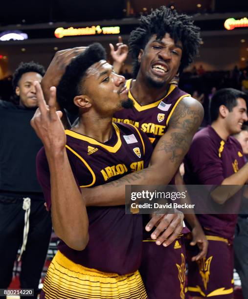 Shannon Evans II and Romello White of the Arizona State Sun Devils celebrate after the team defeated the Xavier Musketeers in the championship game...