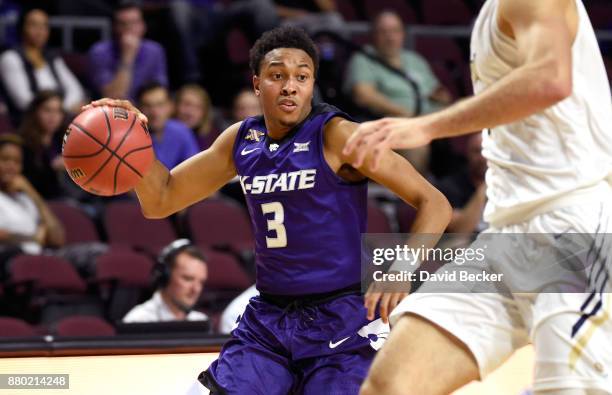 Kamau Stokes of the Kansas State Wildcats drives the ball against the George Washington Colonials during the 2017 Continental Tire Las Vegas...