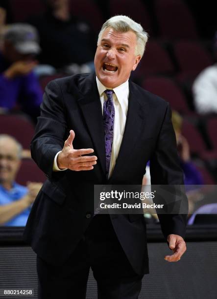 Head coach Bruce Weber of the Kansas State Wildcats gestures while calling to his team against the George Washington Colonials during the 2017...