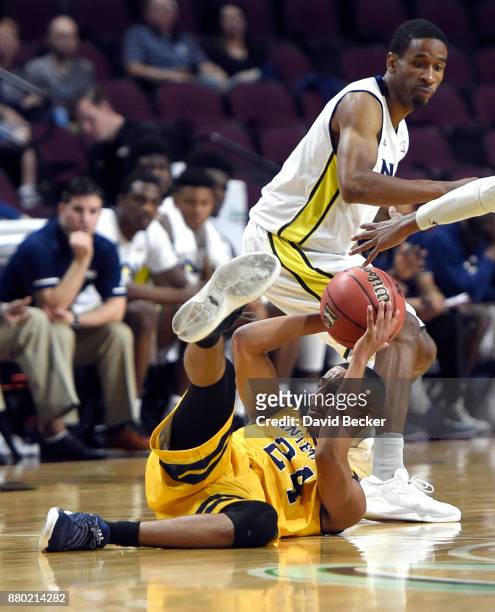 Eyassu Worku of the UC Irvine Anteaters grabs a loose ball against Torry Johnson of the Northern Arizona Lumberjacks during the 2017 Continental Tire...