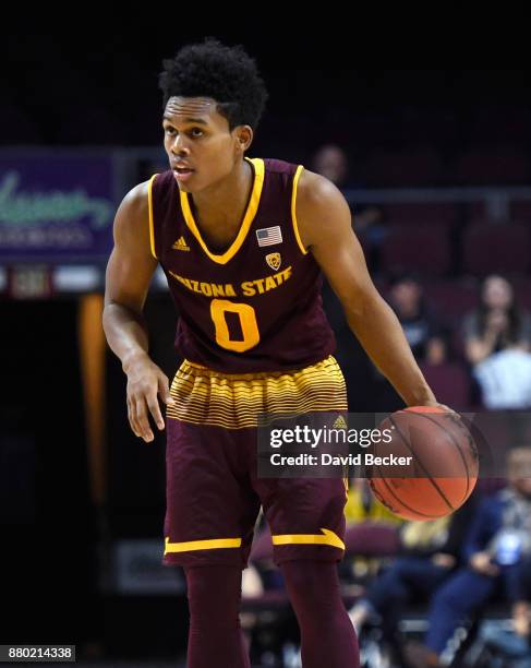 Tra Holder of the Arizona State Sun Devils carries the ball during the championship game of the 2017 Continental Tire Las Vegas Invitational...