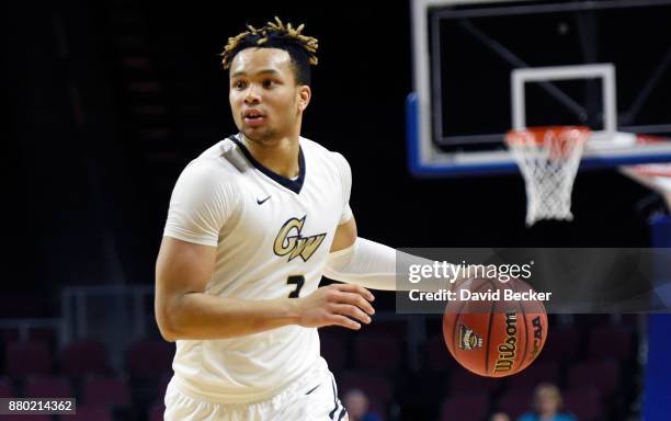 Jair Bolden of the George Washington Colonials drives the ball against the Kansas State Wildcats during the 2017 Continental Tire Las Vegas...