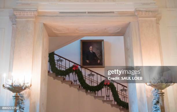 Christmas decorations are seen on the stairs leading to the private residence during a preview of holiday decorations at the White House in...