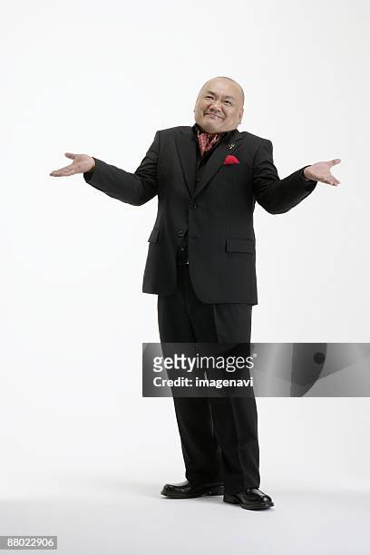 Fat Man In Suit Full Body Photos and Premium High Res Pictures - Getty ...