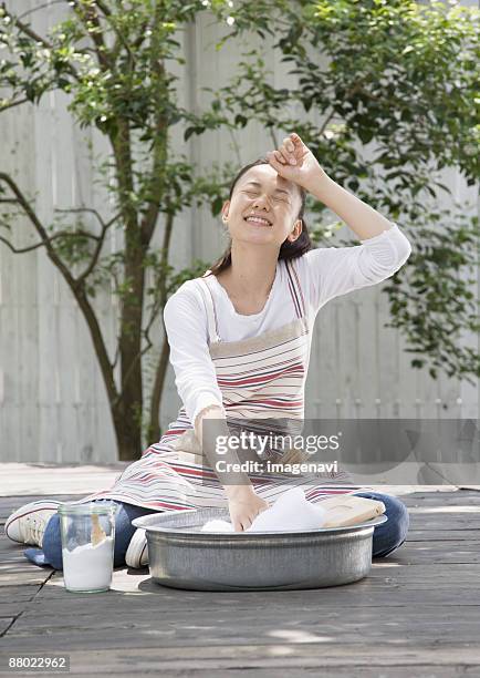 washing clothes - washboard laundry stock pictures, royalty-free photos & images