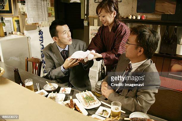 man receiving the hand towel - only japanese stock pictures, royalty-free photos & images