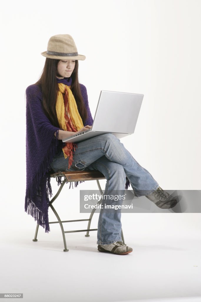 A woman looking at the laptop