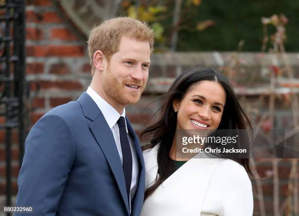 Prince Harry and actress Meghan Markle during an official photocall to announce their engagement at The Sunken Gardens at Kensington Palace on...