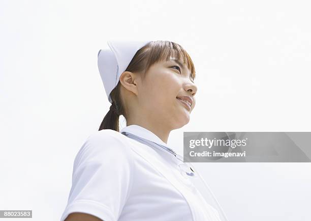 a nurse - nurse hat stock pictures, royalty-free photos & images