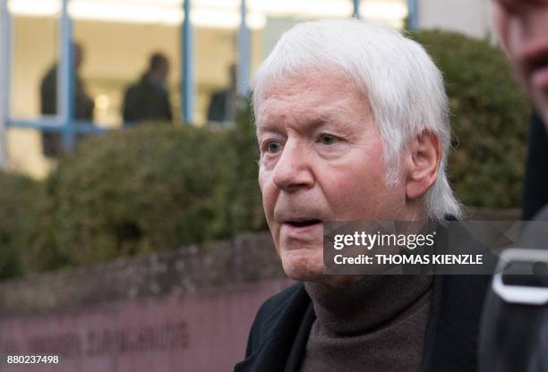 German drugstore chain founder Anton Schlecker leaves the district court in Stuttgart, southwestern Germany, on November 27, 2017. The court handed...