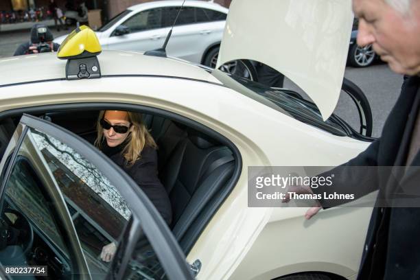 Anton Schlecker , founder of the now bankrupt German drugstore chain Schlecker, and his daughter Meike leave in a taxi after the last day of his...
