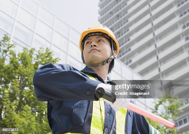 a crossing guard - 交通誘導員 ストックフォトと画像