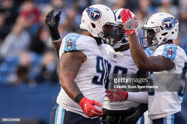 Tennessee Titans defensive lineman DaQuan Jones celebrates a sack with Tennessee Titans linebacker Jayon Brown during the NFL game between the...