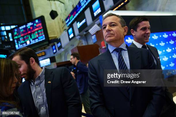 Chief executive officer and chairman of The Walt Disney Company Bob Iger walks on the floor of the New York Stock Exchange before ringing the opening...