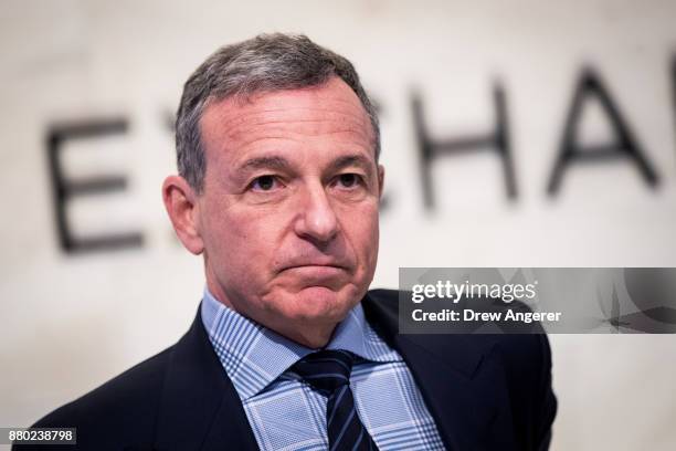 Chief executive officer and chairman of The Walt Disney Company Bob Iger walks on the floor of the New York Stock Exchange before ringing the opening...