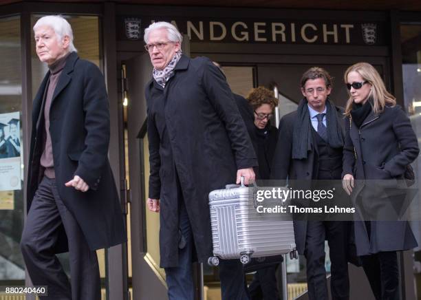 Anton Schlecker , founder of the now bankrupt German drugstore chain Schlecker, and his children Lars and Meike leave after the last day of his trial...