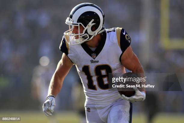 Cooper Kupp of the Los Angeles Rams runs with the ball on a pass play during the second half of a game against the New Orleans Saints at Los Angeles...