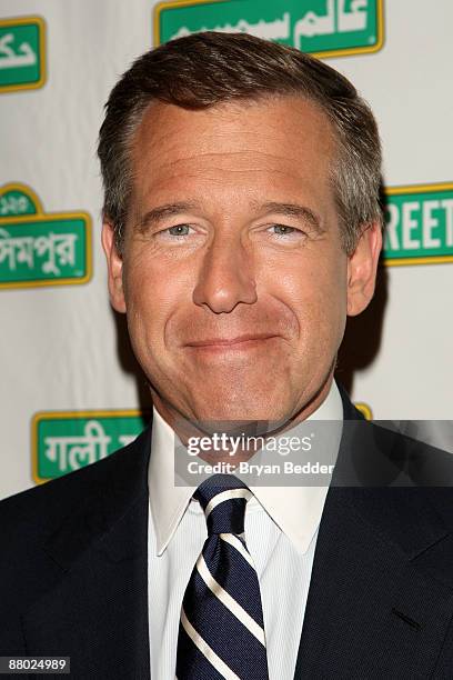 News Anchor Brian Williams poses with Sesame Street Muppets at the 7th annual gala benefiting Sesame Workshop at Cipriani 42nd Street on May 27, 2009...