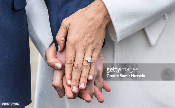 Close up of Meghan Markle's engagement ring during an official photocall to announce the engagement of Prince Harry and actress Meghan Markle at The...