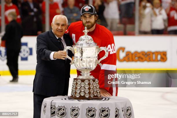 Henrik Zetterberg of the Detroit Red Wings recieves the Clarence S. Campbell Bowl from NHL Senior Vice President of Hockey Operations Jim Gregory...