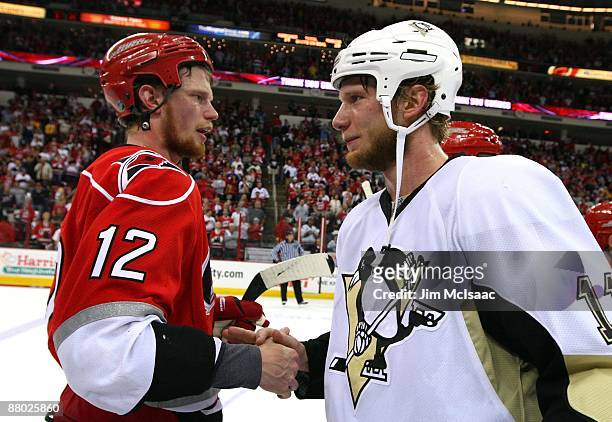 Jordan Staal of the Pittsburgh Penguins is congratulated by his brother Eric Staal of the Carolina Hurricanes after their 4-1 win in Game Four of the...
