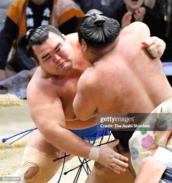 Komusubi Kotoshogiku and Shohozan compete during day fourteen of the Grand Sumo Kyushu Tournament at Fukuoka Convention Center on November 25, 2017...