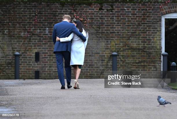 Prince Harry and actress Meghan Markle attend an official photocall to announce their engagement at The Sunken Gardens at Kensington Palace on...