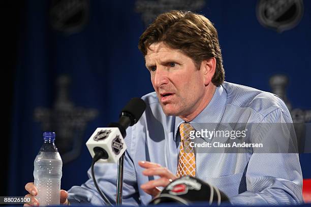 Head coach Mike Babcock of the Detroit Red Wings answers questions from the media at a press conference after their 2-1 overtime win against the...