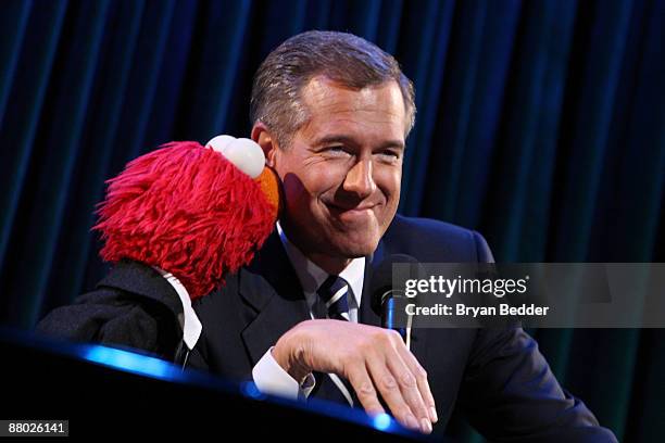 News Anchor Brian Williams appears onstage with Elmo at the 7th annual gala benefiting the Sesame Workshop at Cipriani 42nd Street on May 27, 2009 in...