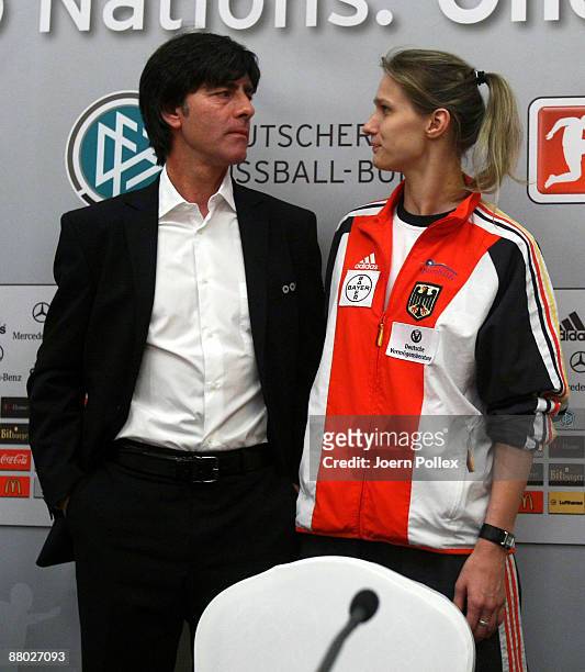 Headcoach Joachim Loew and fencing olympic champion Britta Heidemann attend the German National Team press conference at the Portman Ritz-Carlton...