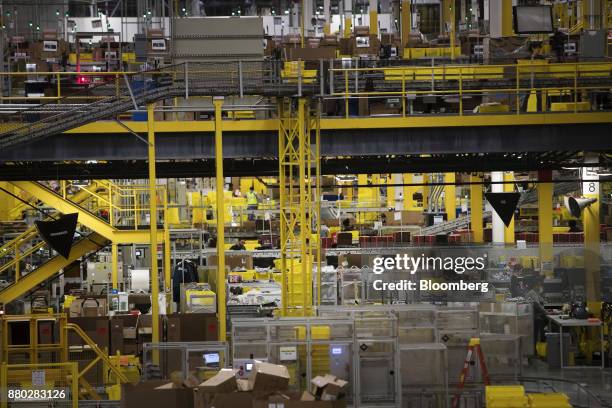 An employee works at the Amazon.com Inc. Fulfillment center in Robbinsville, New Jersey, U.S., on Monday, Nov. 27, 2017. The holiday shopping season...