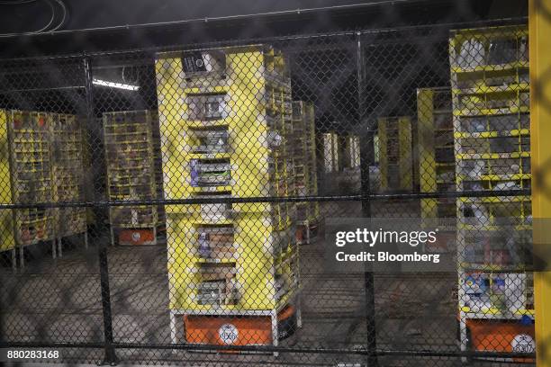 Kiva Systems Inc. Robots move shelves at the Amazon.com Inc. Fulfillment center in Robbinsville, New Jersey, U.S., on Monday, Nov. 27, 2017. The...